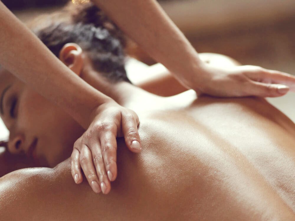 Hands-on lymphatic drainage bodywork during BBL recovery